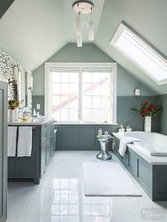 a pretty bathroom remodel with blue hues and white tile